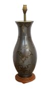 A Chinese style pewter and bronze table lamp, decorated with flower and bell motifs, height 58cm