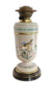 A Victorian Aesthetic movement enamelled mushroom coloured glass oil lamp decorated with a bird