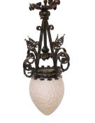 A French Arts & Crafts black wrought iron fitting with large frosted acorn, diameter 25cm, height