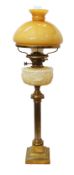 A late Victorian brass oil lamp with opaque coloured glass reservoir, Hinks No.2 duplex mechanism