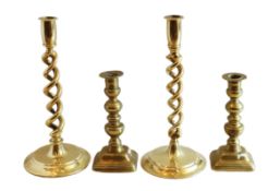 A pair of early 20th century English spiral twist brass candlesticks, height 31cm, and a pair of