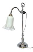An Edwardian style chrome plated adjustable desk lamp with opaque glass trumpet shade, height