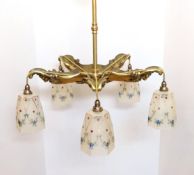An early 20th century French five light electrolier modelled with satyr masks and hung with