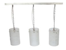 A set of three Mid Century hanging glass pendants with replacement tracking, shade diameter 14cm,