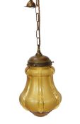 An early 20th century French brass mounted amber tinted glass light fitting, height 32cmN