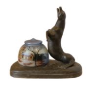 An early 20th century French bronzed spelter desk lamp modelled with a sea lion, with associated
