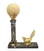A 1930's French gilt spelter and marble desk lamp modelled as a bird perched beside a column with