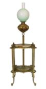 A late 19th century American cast brass and green onyx oil lamp standard, with two tier base,