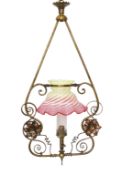 A late 19th century English Arts & Crafts brass and copper gasolier light fitting with cranberry