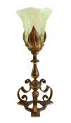 An early 20th century English Hinks brass table lamp with foliate moulded vaseline glass trumpet