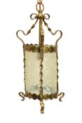 An English Arts & Crafts brass light fitting with floral moulded vaseline glass liner, height