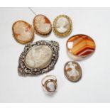 Two modern 9ct gold mounted oval cameo shell brooches, a 9ct gold and cameo shell set ring, three