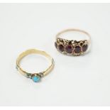 A Victorian garnet and seed pearl dress ring, size O, and a turquoise set yellow dress ring, size K