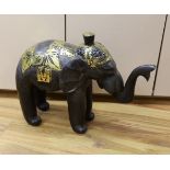 A carved Indian elephant, decorated with gilt decoration, 49cm high