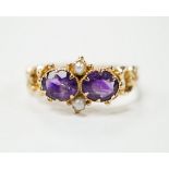 A Victorian style yellow metal, amethyst and pearl dress ring, size L