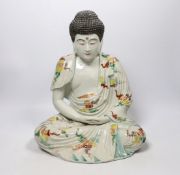 An early 20th century Chinese or Japanese enamelled porcelain figure of Buddha, 33cm