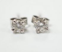 A pair of 9ct white gold solitaire diamond ear studs