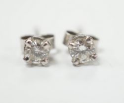 A pair of 9ct white gold solitaire diamond ear studs