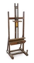 A Winsor & Newton oak studio easel, with cast brass plaque ‘Studio Easel, Winsor & Newton, Ltd,