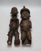 A pair of African tribal carved figures, tallest 53cm