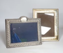 A modern white metal photograph frame with gadrooned border, height 20cm, and a similar planished