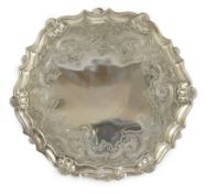 A George II silver salver, by John Robinson II, of shaped circular form, with later engraved