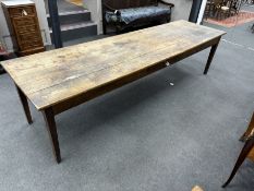 A large 19th century French rectangular fruitwood farmhouse table, fitted drawer, length 290cm,