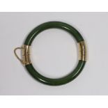 Am Eastern gilt metal mounted nephrite hinged bangle, 7.5cm