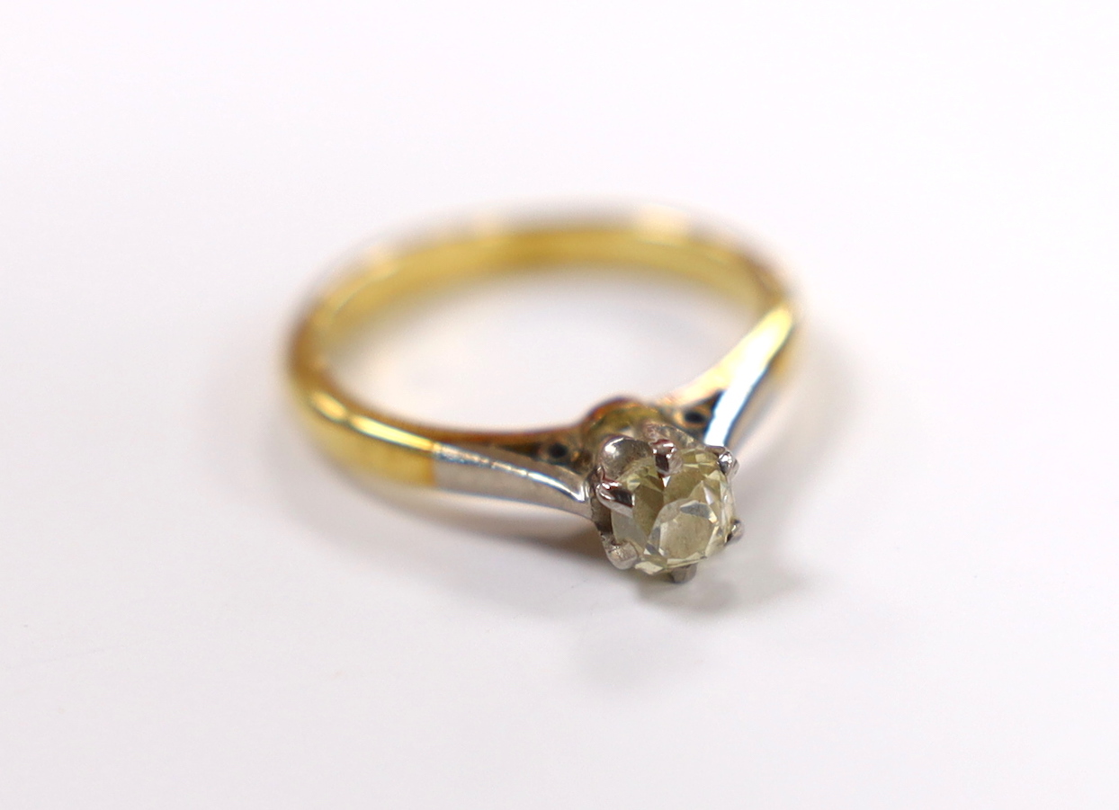 A yellow metal and solitaire diamond set ring, size G/H, gross weight 2.7 grams.