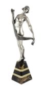 Henri Fugère (1872-1944). An Art Deco silvered bronze figure of a nude dancer, standing upon a