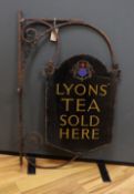 A wrought iron and enamel ‘Lyon’s’ tea sold here’ advertising sign, 92cm high