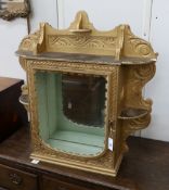 A late Victorian gilt painted carved wall cabinet, width 84cm, height 86cm