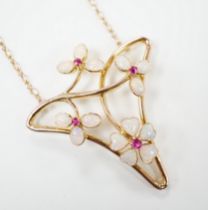 A yellow metal ruby and white opal set Art Nouveau style necklace, in Carrington & Co. box, 4cm