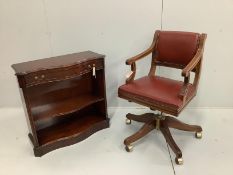 A reproduction mahogany framed swivel desk armchair, upholstered in red leather, width 54cm,