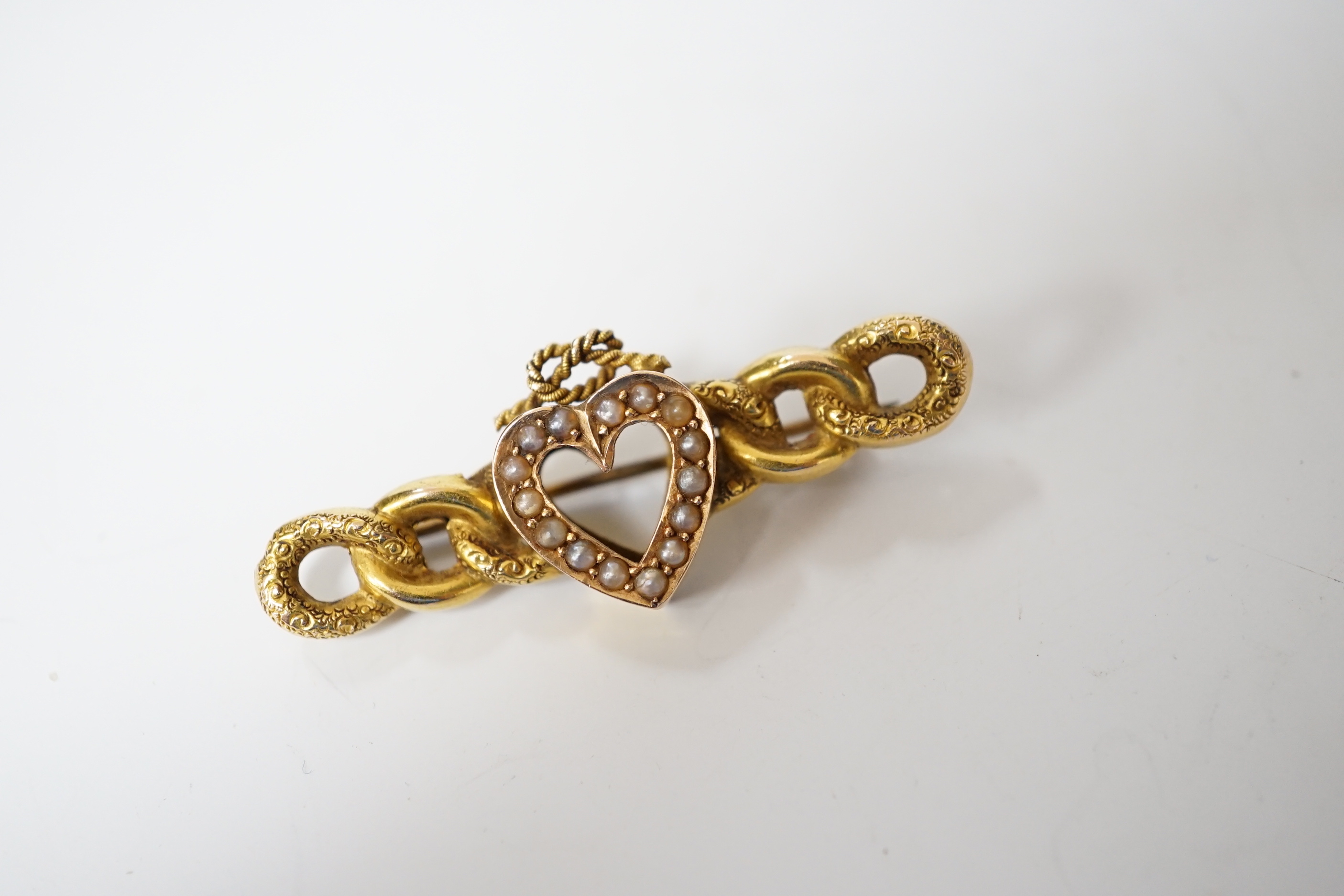 A late Victorian 15ct gold and seed pearl set bar brooch, with central heart with knot motif, - Image 2 of 3