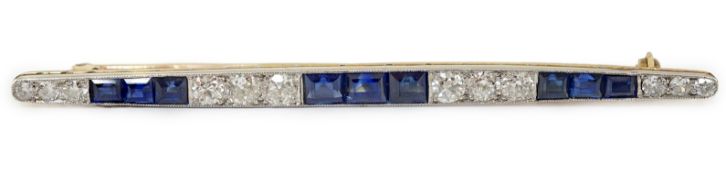 An Art Deco, round cut diamond and rectangular cut sapphire cluster bar brooch, set with twelve