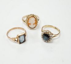 Two 9ct gold cameo rings, size N and Q, and a pearl and sapphire cluster ring, size N