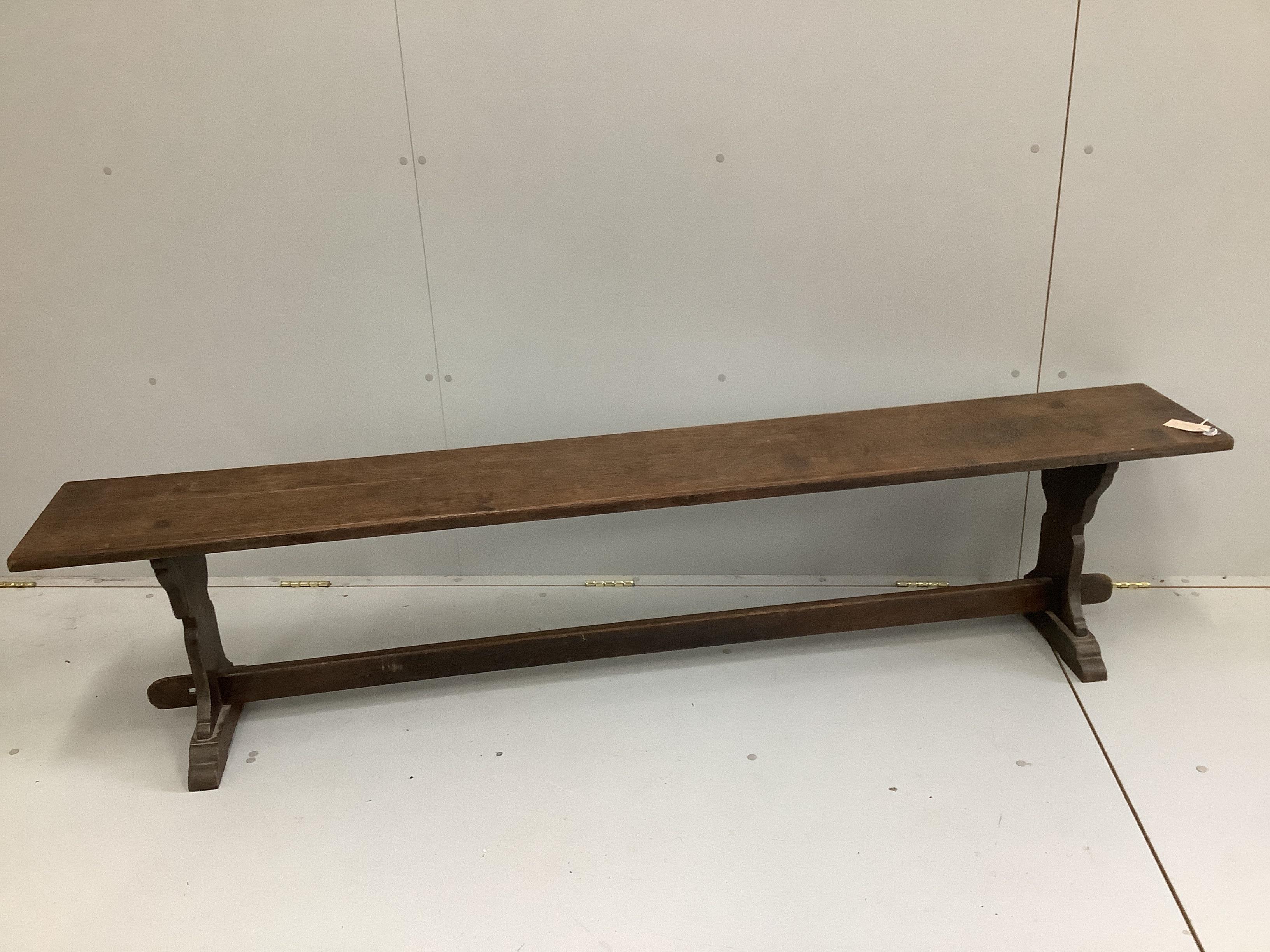 A 19th century provincial oak bench, length 200cm, depth 29cm, height 45cm