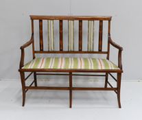 An Edwardian Art Nouveau inlaid mahogany salon settee, length 109cm, depth 46cm, height 92cm