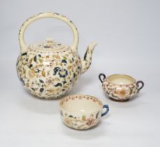 A Zsolnay teapot, teacup and sugar bowl, tallest 22cm