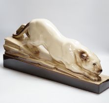 An Art Deco porcelain model of a panther, indistinctly signed, 57cm