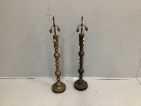 A pair of brass lamp bases, height 94cm