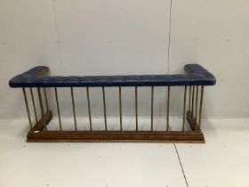 A late Victorian brass and oak club fender, with a buttoned blue leather cushioned seat, width