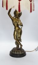 A vintage Indian polished brass figure of a dancer on lotus base, now mounted as a lamp, 80cm