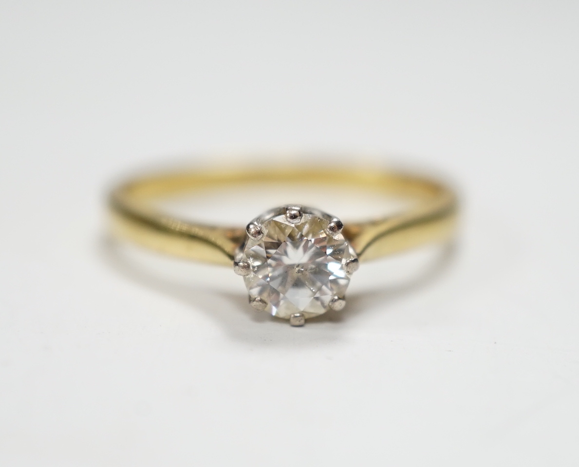 A modern 18ct gold and solitaire diamond ring, the stone measuring 5.2mm in diameter, size O/P,