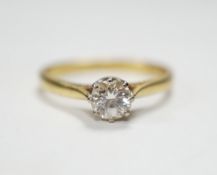 A modern 18ct gold and solitaire diamond ring, the stone measuring 5.2mm in diameter, size O/P,