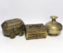 Eastern brassware to include a betel box on wheels, a vase with engraved detail and a pierced box,