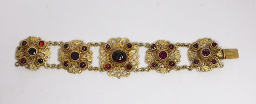 A Continental gilt metal bracelet inset with cabochon, garnets and pastes, length 15.5cm