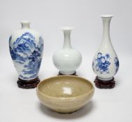 Two modern Chinese blue and white vases on stands, a crackle glaze celadon bowl and vase, tallest