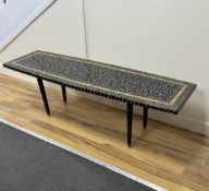 A mid century Japanese coffee table with pebble effect top, width 137cm, depth 43cm, height 42cm